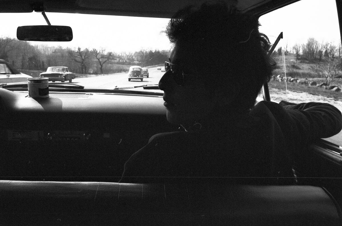Bob Dylan on the Highway, Massachusetts, April 1964; photograph by John Byrne Cooke.