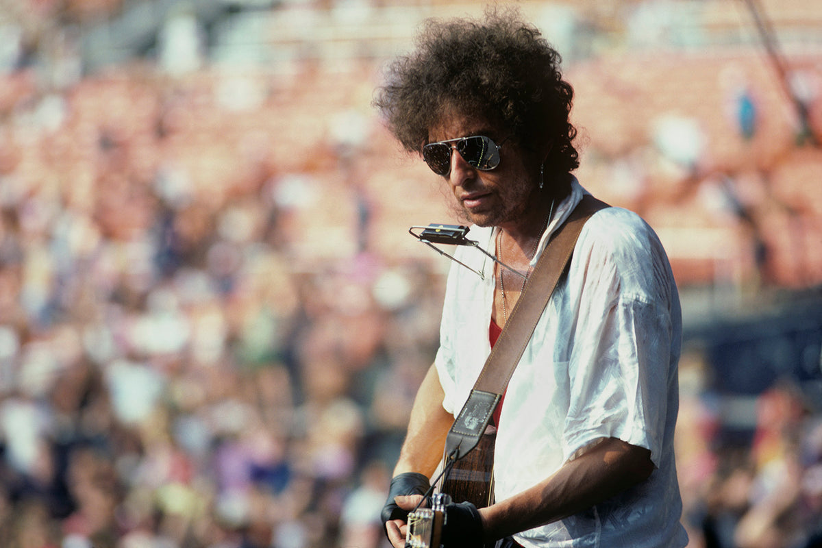 Bob Dylan Playing Harmonica, RFK Stadium, Washington, D.C., 1986. Photograph by Ebet Roberts.