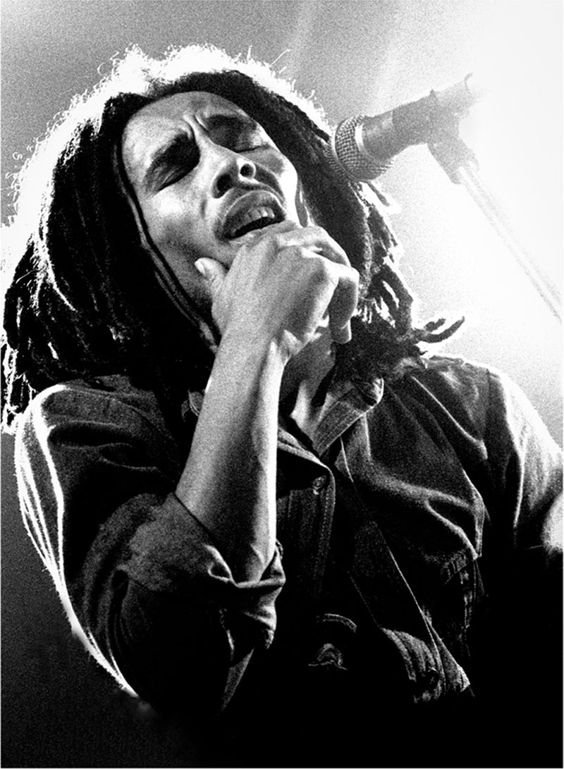 Bob Marley singing in a close-up performance portrait in 1977. Photograph by Gijsbert Hanekroot.