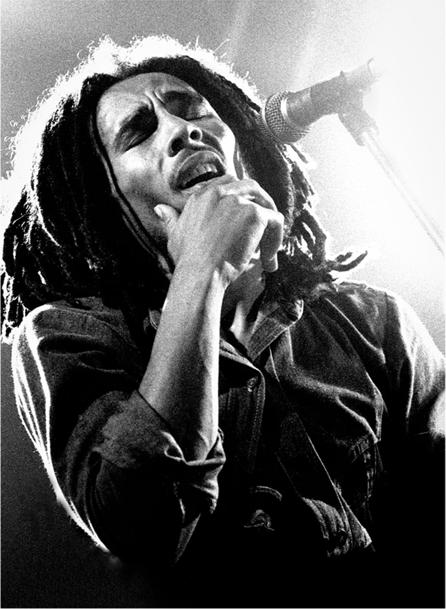 Bob Marley singing in a close-up performance portrait in 1977. Photograph by Gijsbert Hanekroot.