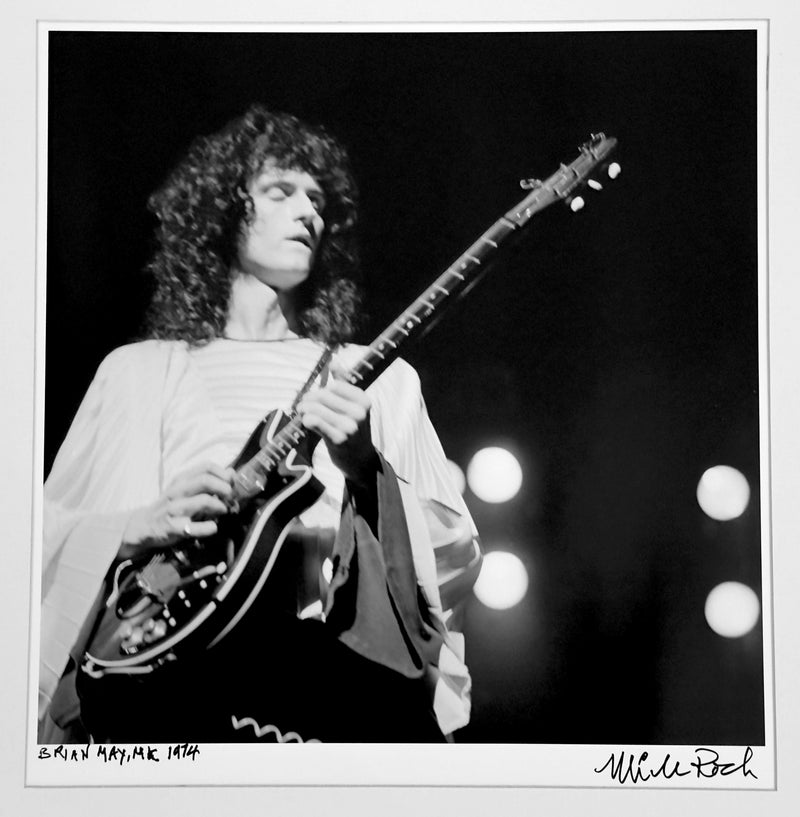 Brian May of Queen playing his Red Special guitar on stage in the UK, 1974 — photograph by Mick Rock, a signed, hand-titled late print.