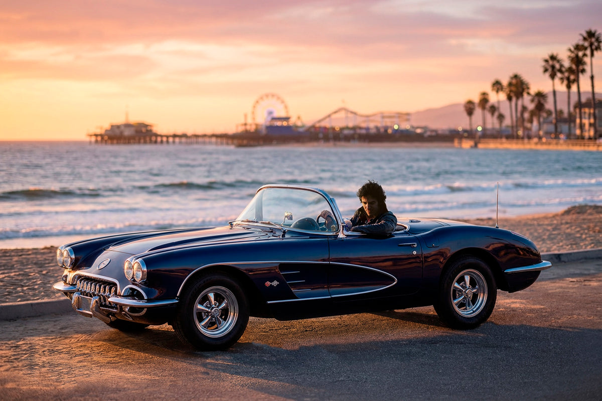 Bruce Springsteen at the wheel of a convertible Corvette by the beach at sunset, 1978, photographed by Lynn Goldsmith.