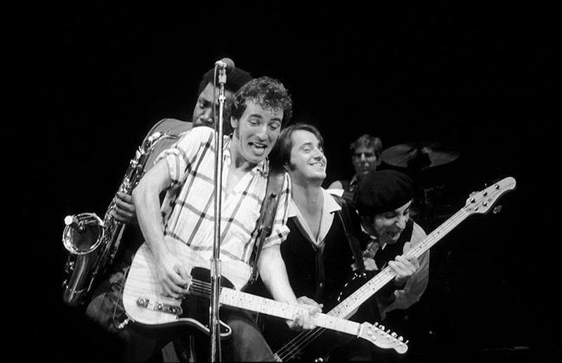 Bruce Springsteen on stage with Clarence Clemons, Steven Van Zandt and Garry Tallent of the E Street Band, photographed by Charlyn Zlotnik.