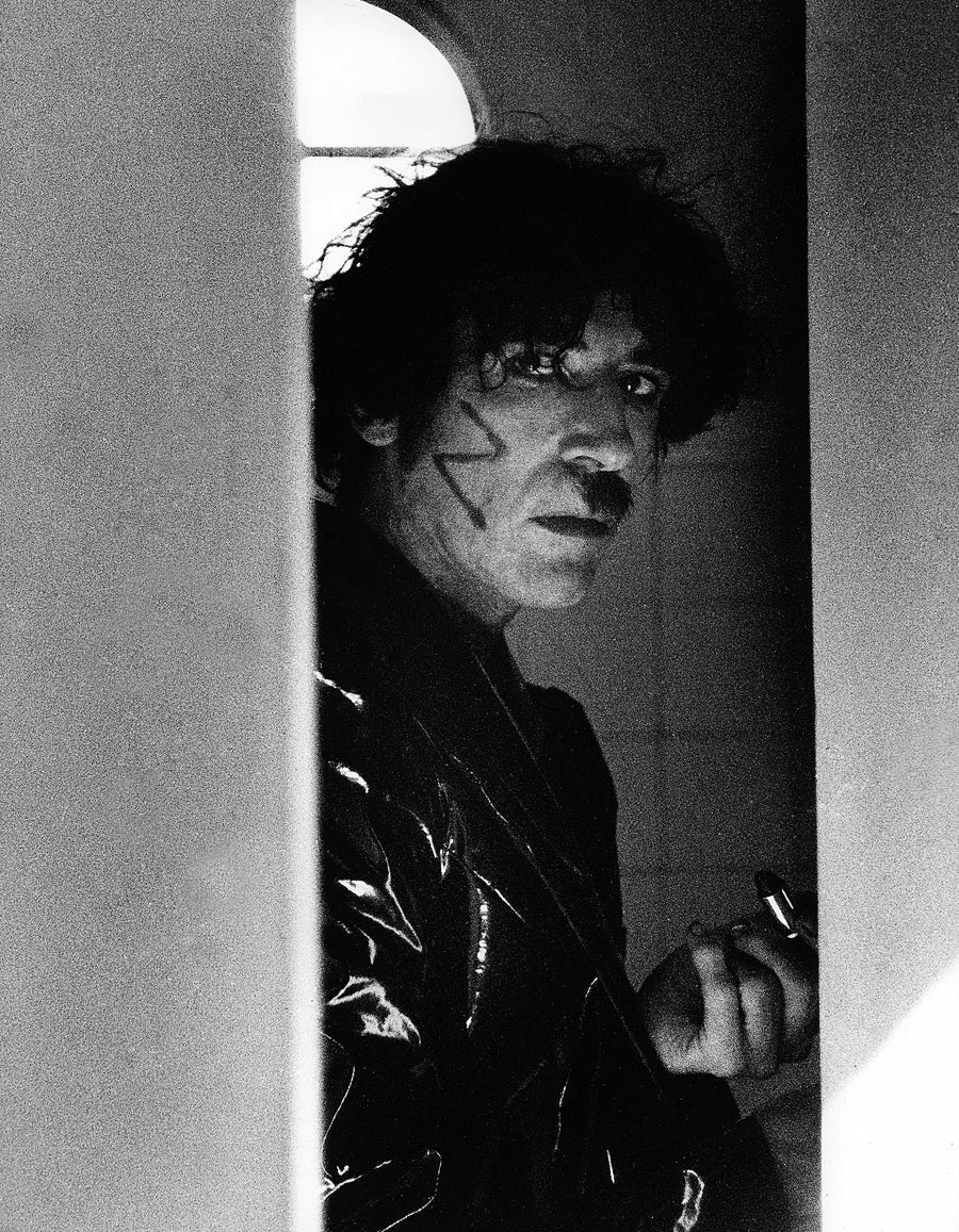 Charly Garcia Behind the Door, Buenos Aires, Argentina, 1996, photographed by Andy Cherniavsky.