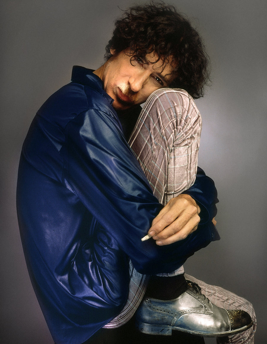Charly Garcia, Curled Pose, Buenos Aires, Argentina, 1996, photographed by Andy Cherniavsky.