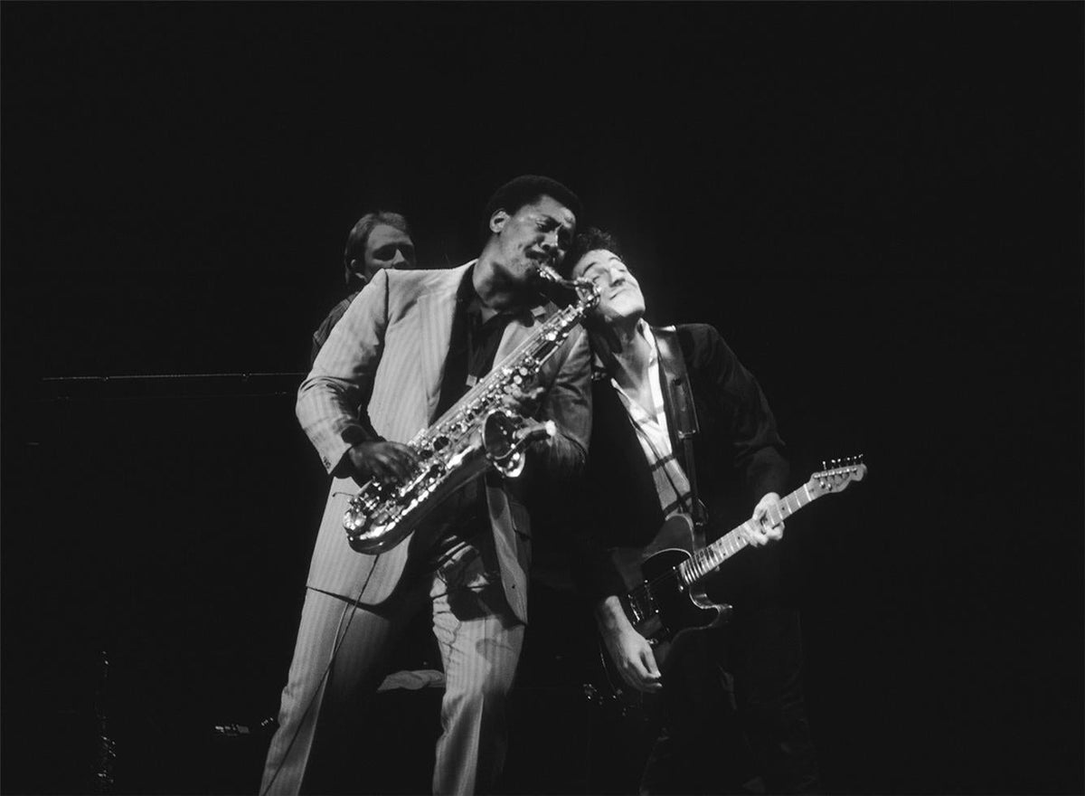 Clarence Clemons and Bruce Springsteen performing together with the E Street Band, photographed by Charlyn Zlotnik.