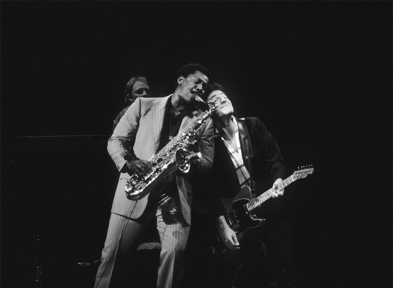 Clarence Clemons and Bruce Springsteen performing together with the E Street Band, photographed by Charlyn Zlotnik.