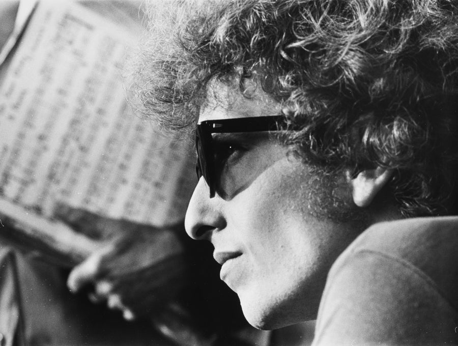 Portrait of photographer Daniel Kramer wearing dark sunglasses during the Bob Dylan years, New York, circa 1965.