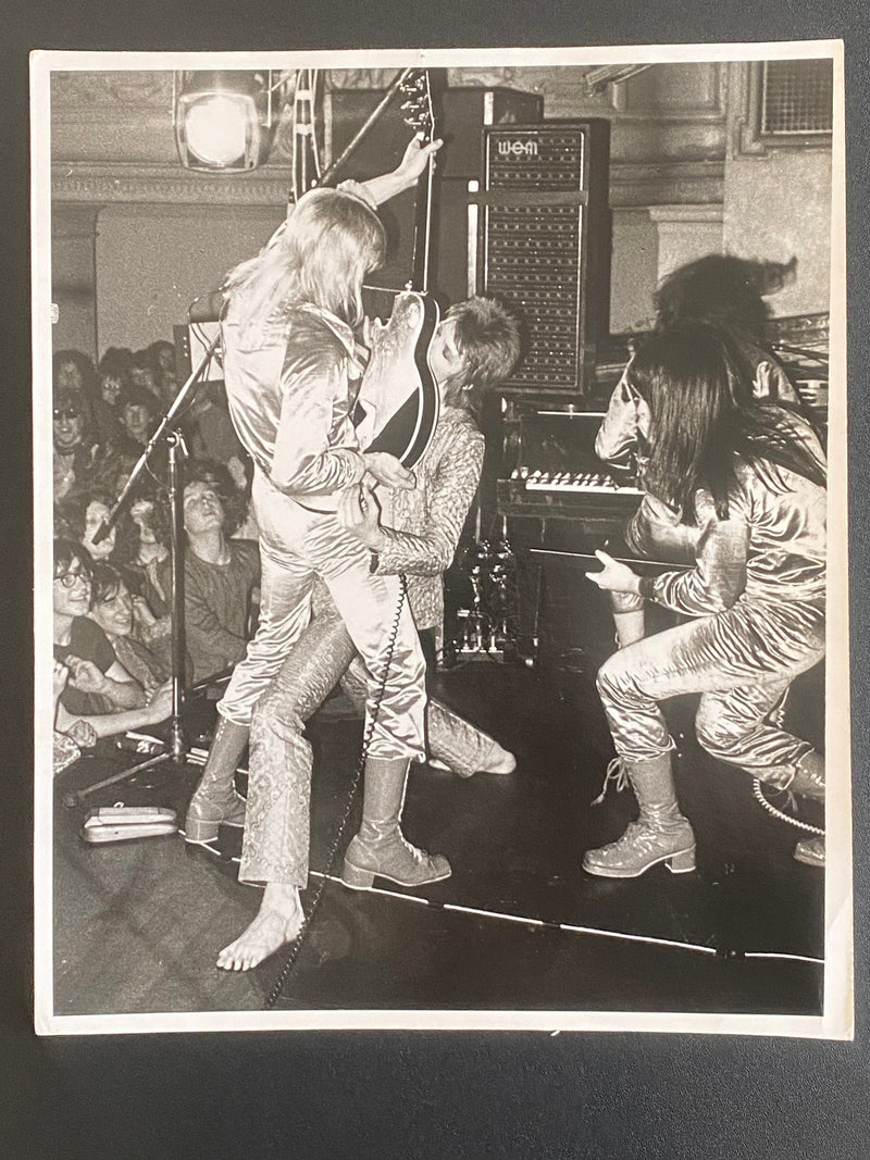 David Bowie and Mick Ronson in the Guitar Fellatio image, 1972, photographed by Mick Rock. Unique vintage gelatin silver print.