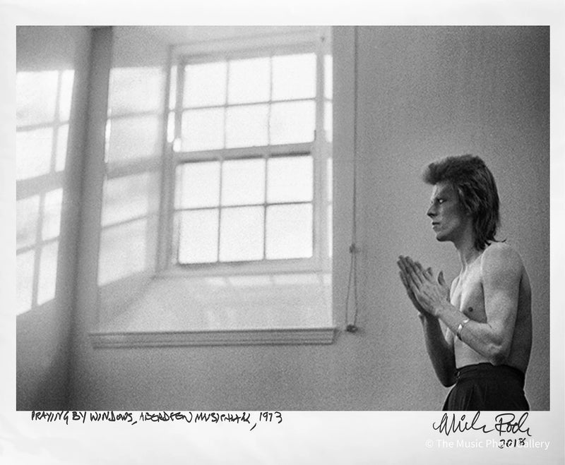 Signed late print of David Bowie by a tall window, Scotland, 1973, by Mick Rock.