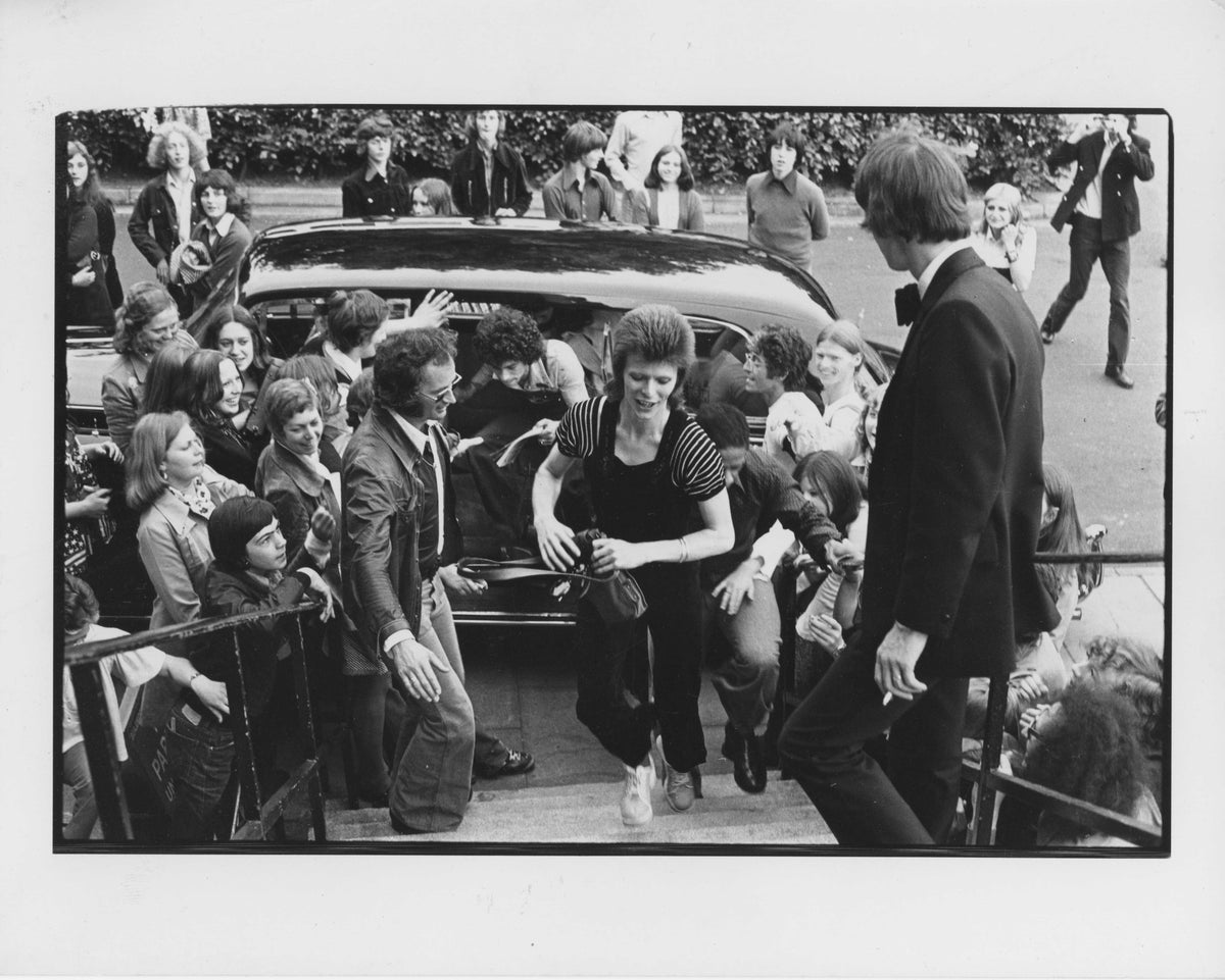 David Bowie performing at Guildford Civic Hall, May 1973, photographed by Mick Rock. Unique vintage gelatin silver print.