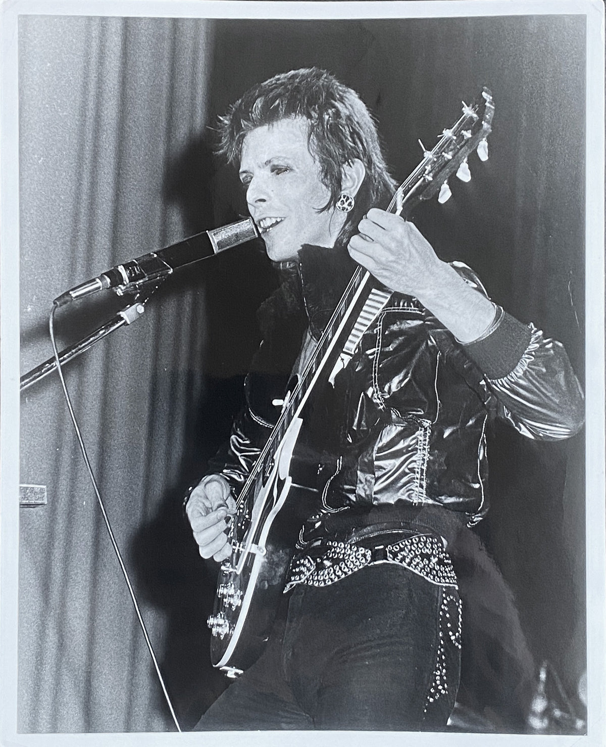 David Bowie with a guitar, London, 1972, photographed by Mick Rock. Unique vintage gelatin silver print.