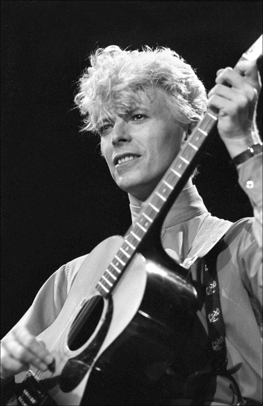 David Bowie with guitar, Madison Square Garden, New York City, 1983, photographed by Allan Tannenbaum.