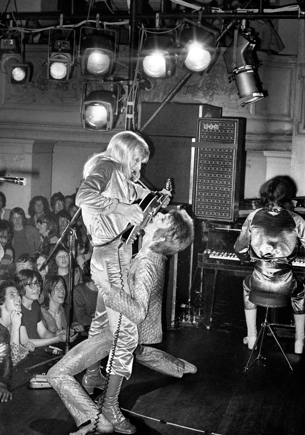 David Bowie and Mick Ronson, Guitar Fellatio, 1972, photographed by Mick Rock.