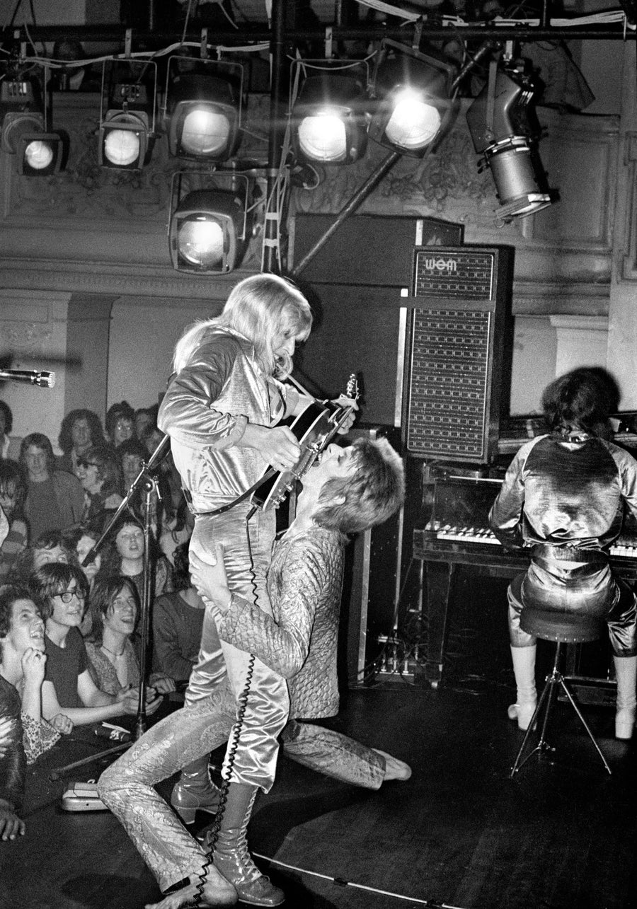 David Bowie and Mick Ronson, Guitar Fellatio, 1972, photographed by Mick Rock.
