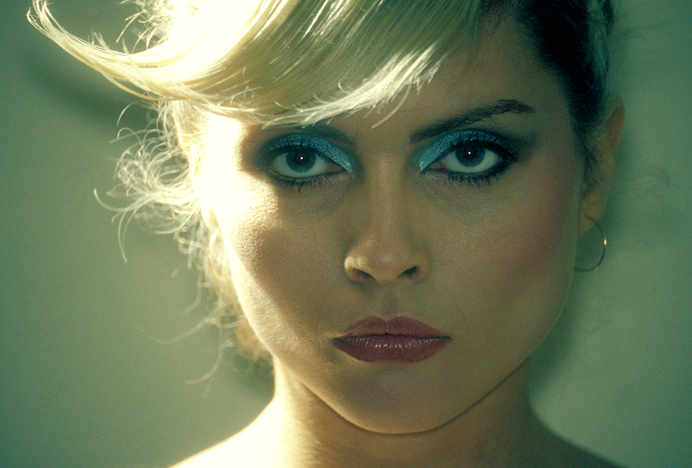 Close-up of Debbie Harry with pale blue eye shadow and swept-back blonde hair, Gramercy Park Hotel, New York City, photographed by Martyn Goddard, 1978.