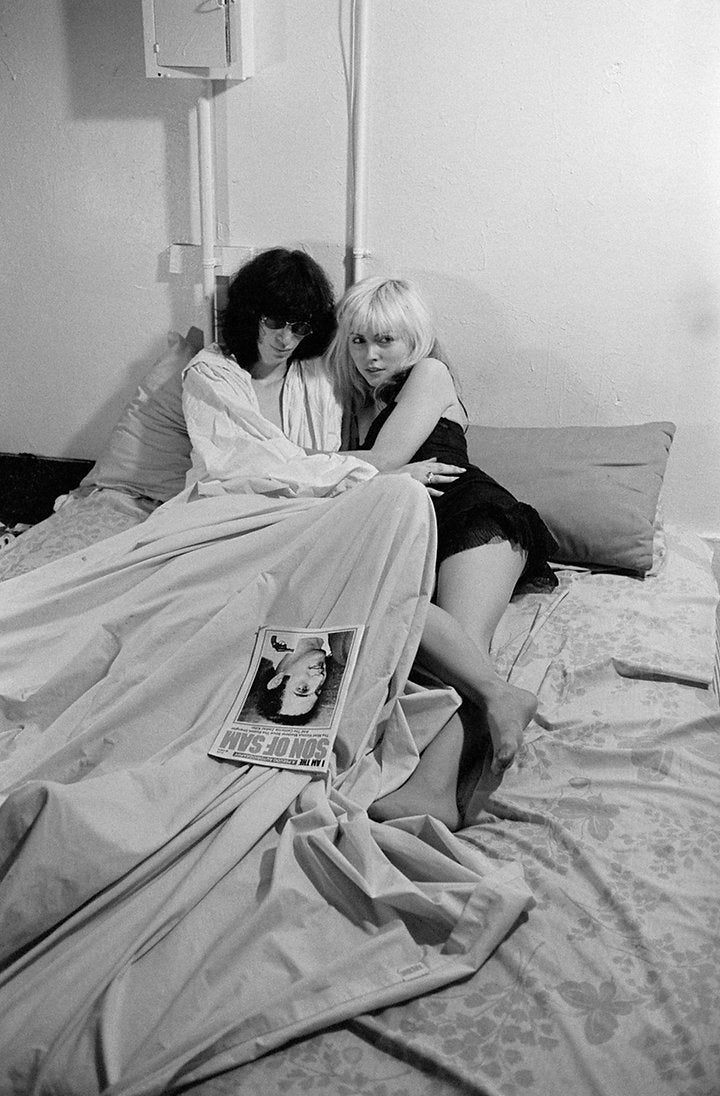 Debbie Harry and Joey Ramone on a bed, New York City, 1977, photographed by Roberta Bayley.