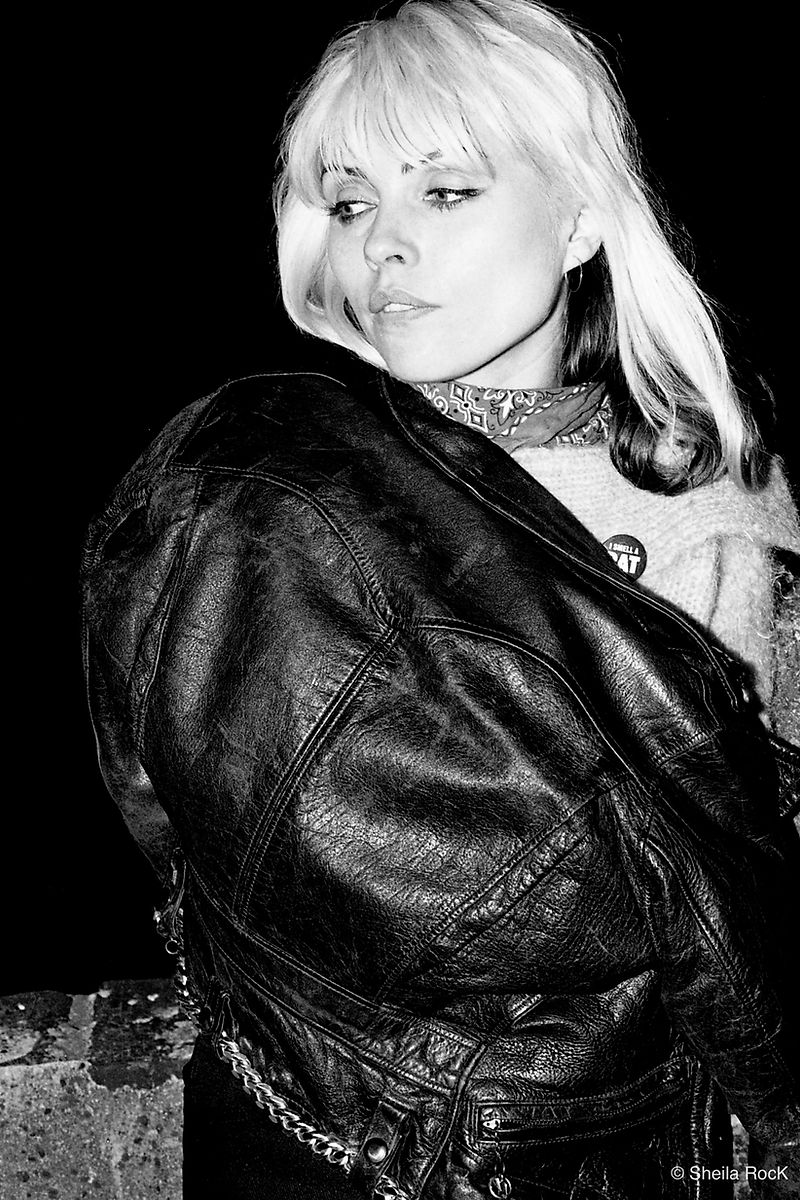 Debbie Harry in leather jacket looking over her shoulder, London, 1977, photographed by Sheila Rock.