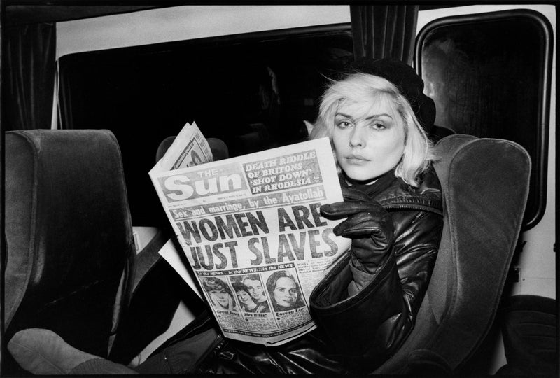 Debbie Harry with Newspaper, New York City, 1977, photographed by Chris Stein.