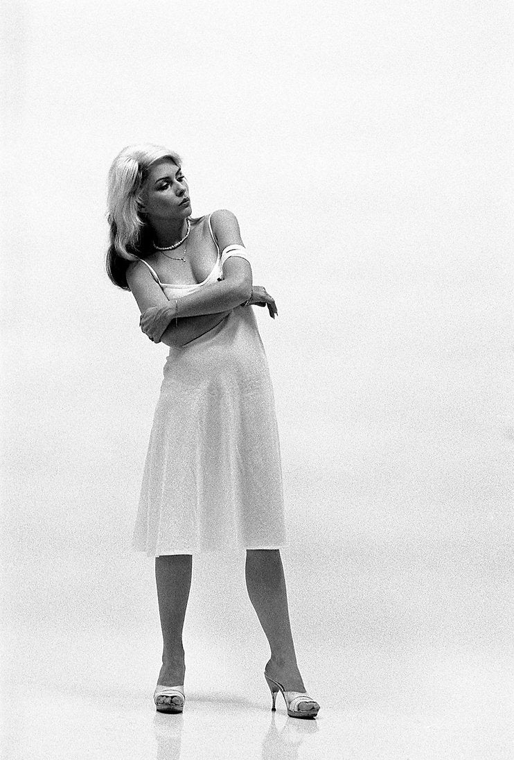 Debbie Harry wearing a white dress, New York City, 1978, photographed by Roberta Bayley.