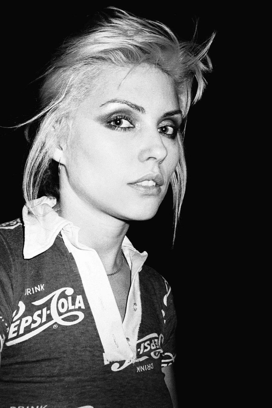 Debbie Harry wearing a Pepsi-Cola shirt, New York City, 1977, photographed by Bobby Grossman.