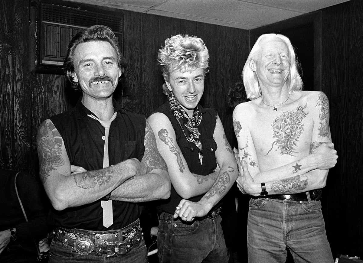 Dickey Betts, Brian Setzer, Johnny Winter, backstage Capitol Theatre. Photograph by Ebet Roberts.