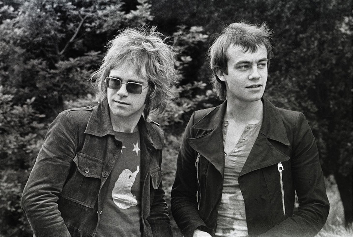 Elton John and Bernie Taupin on Hampstead Heath, London, 1970, photographed by Barrie Wentzell.