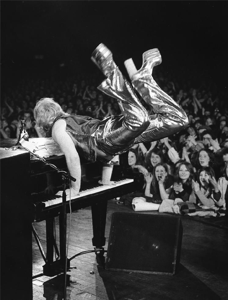 Elton John performing at the Sundown Theatre in London, 1973, photographed by Barrie Wentzell.