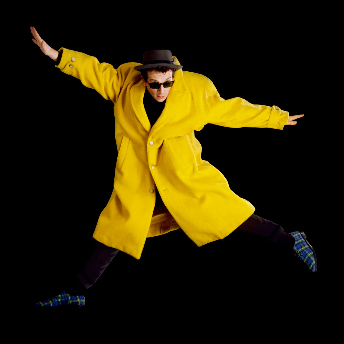 Elvis Costello in the Yellow Coat, London, 1986, photographed by Chalkie Davies.
