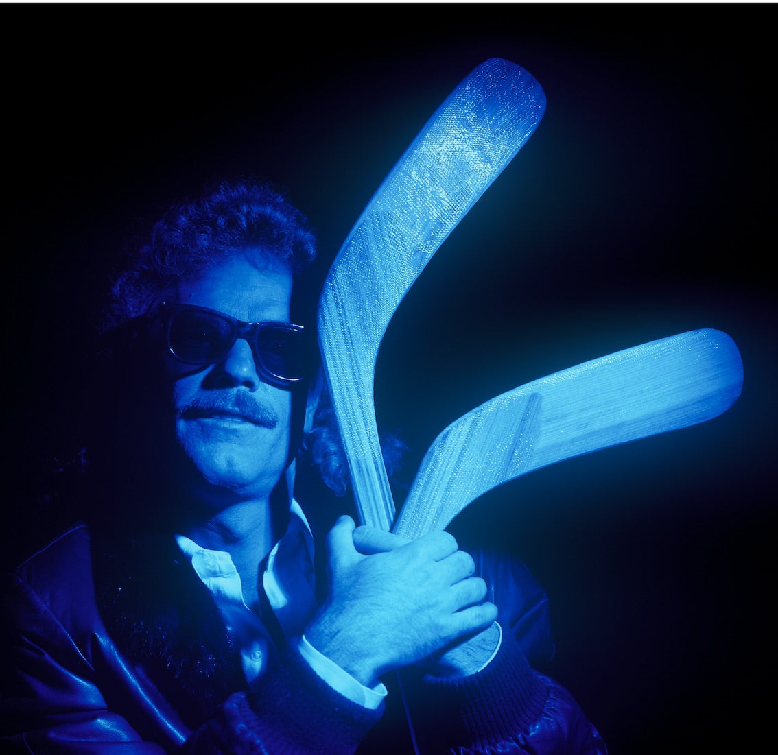 Frank Beard of ZZ Top, studio portrait with hockey sticks, Montreal, c. 1985, photographed by George DuBose.