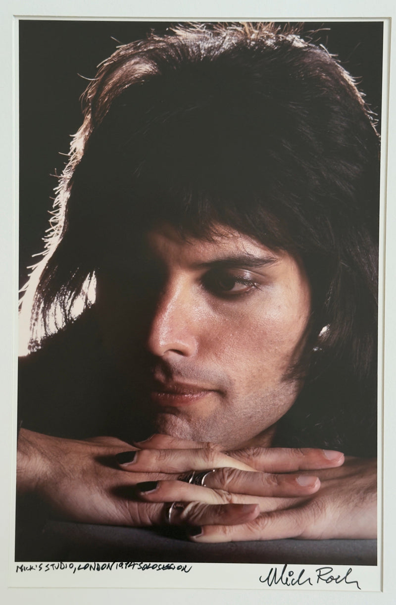 Freddie Mercury close portrait in Mick Rock's London studio, 1974, hand-titled and signed by Mick Rock.