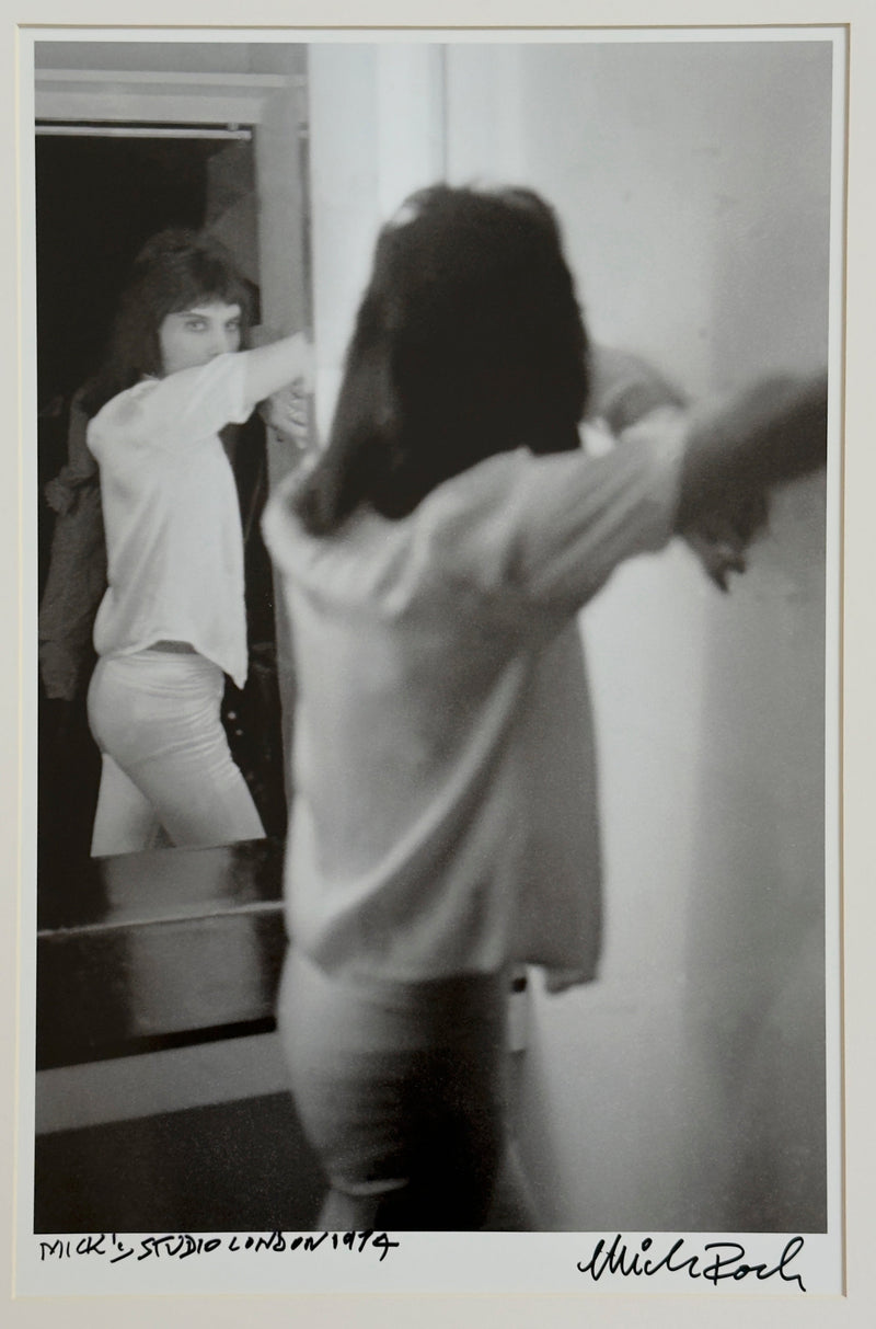 Freddie Mercury reflected in Mick Rock's London studio, 1974, hand-titled and signed by Mick Rock.