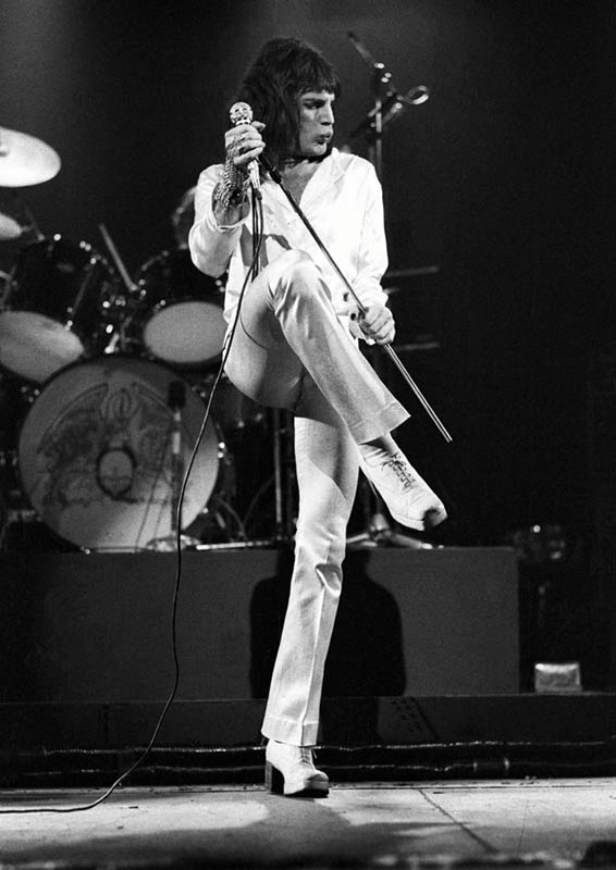 Freddie Mercury performing on stage with Queen in London, UK, photographed by Ian Dickson.