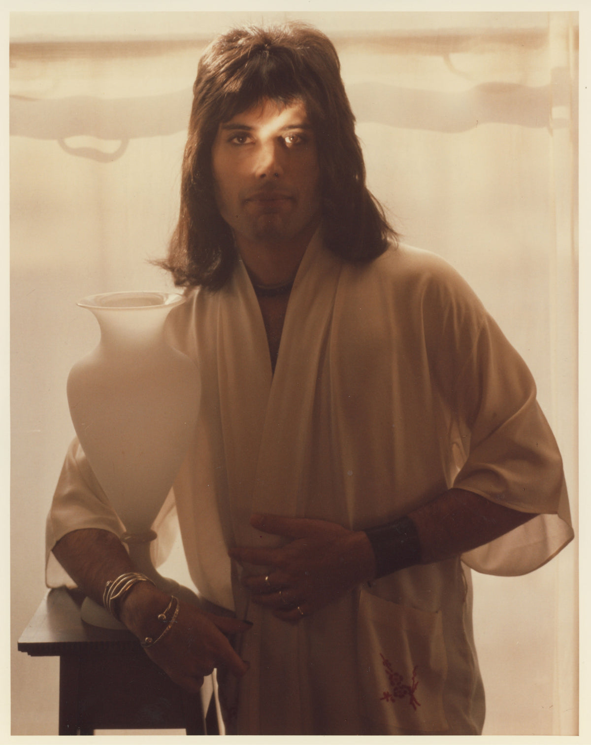 Freddie Mercury holding a goblet, London, 1974, photographed by Mick Rock. Unique vintage chromogenic colour print.
