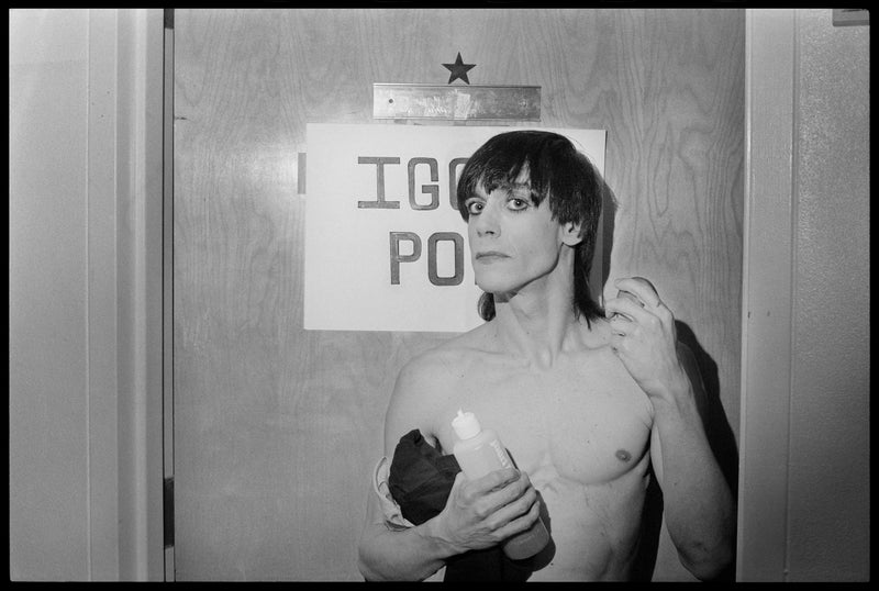 Iggy Pop by the dressing room door, New York City, 1977, photographed by Chris Stein.