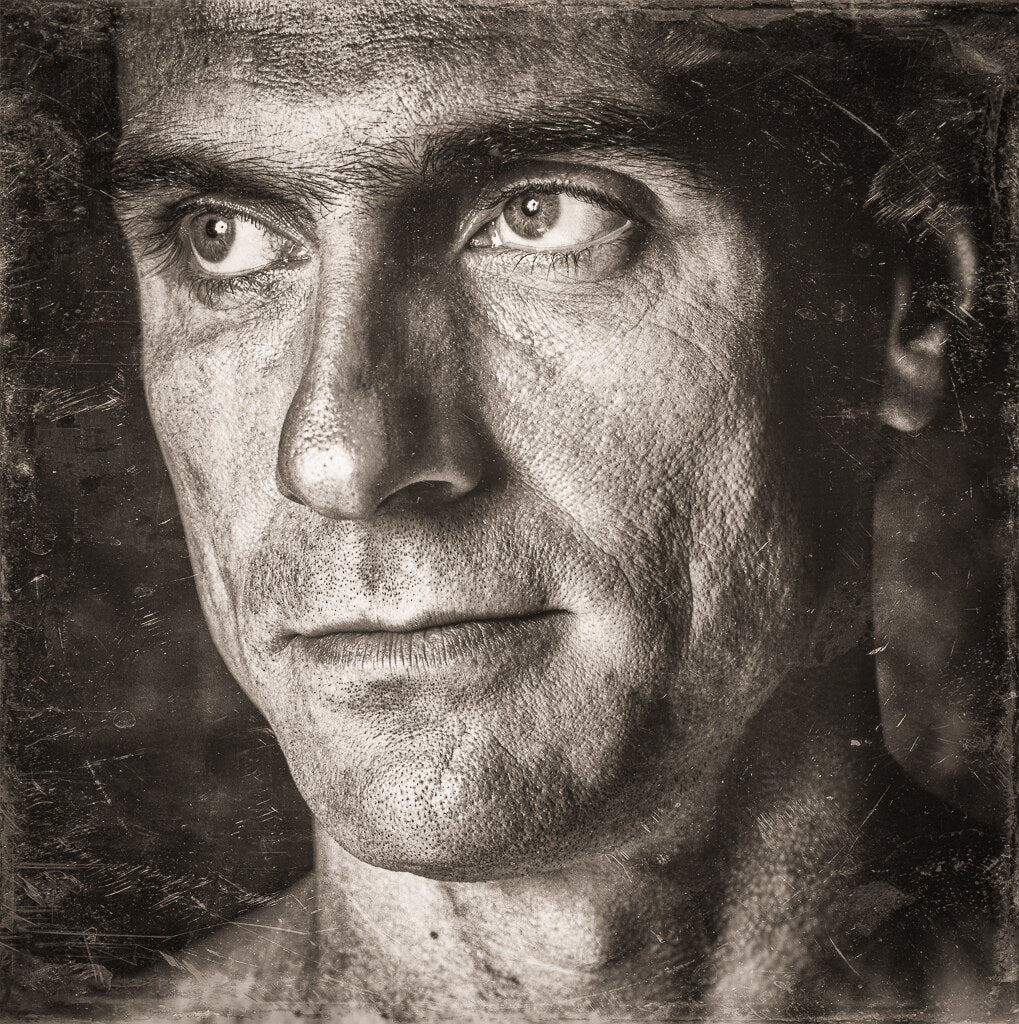 Close sepia portrait of James Taylor, 1985, photographed by Lynn Goldsmith.