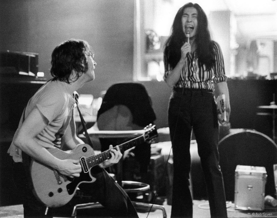 John Lennon playing guitar and Yoko Ono singing at Butterfly Studio in New York City, 1972, photographed by Bob Gruen.