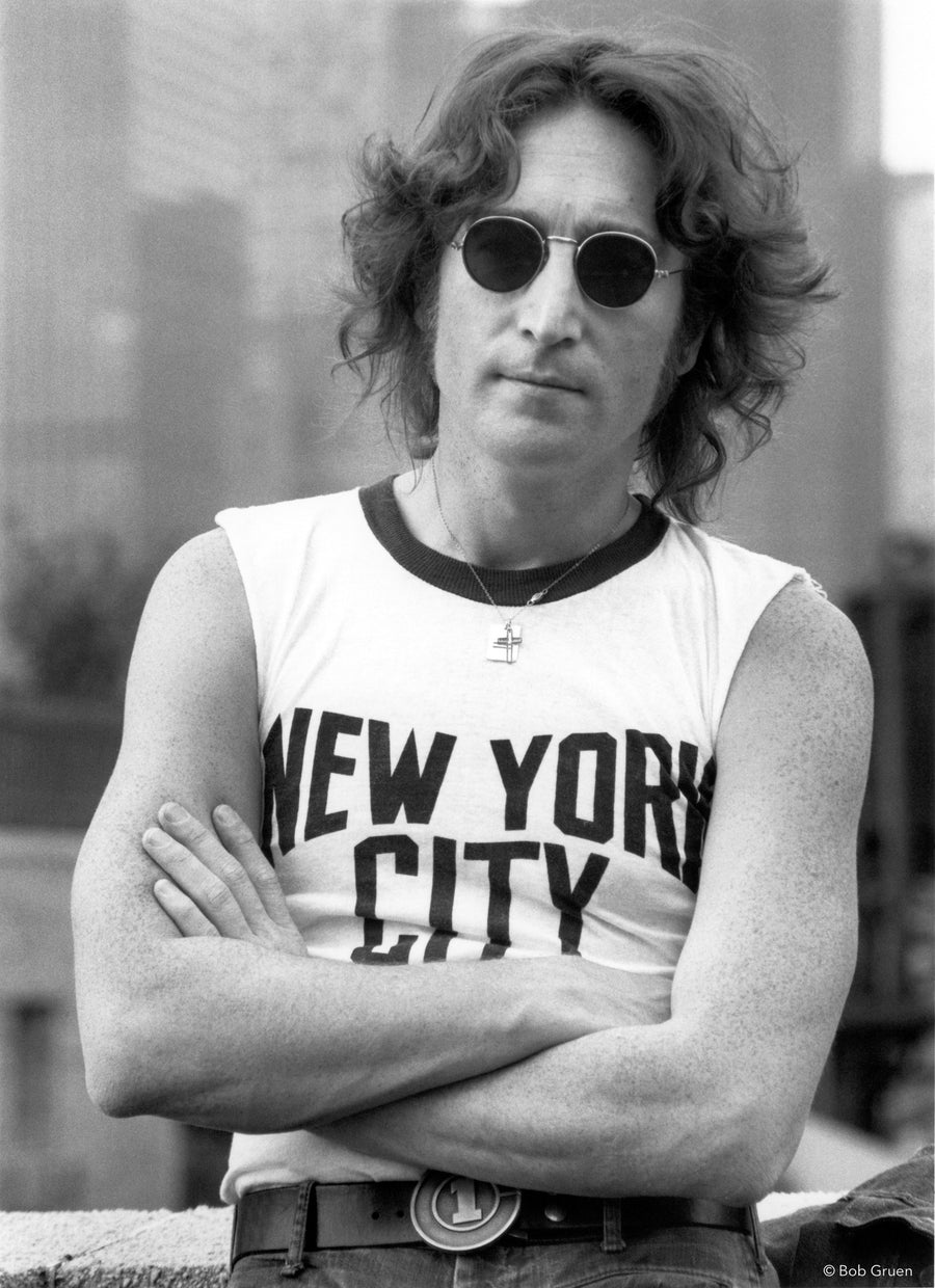 John Lennon wearing his iconic NYC T-Shirt in New York City, 1974, photographed by Bob Gruen.