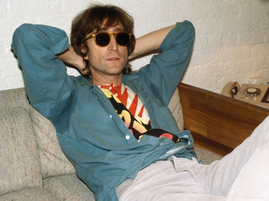 John Lennon reclining on a sofa at Hit Factory, New York City, 1980, photographed by Bob Gruen.