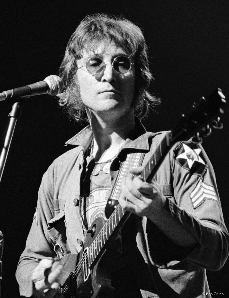 John Lennon performing at the One to One Concert at Madison Square Garden in New York City, 1972, photographed by Bob Gruen.