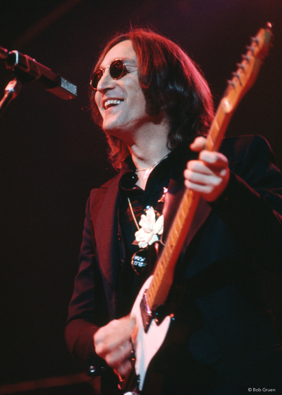 John Lennon performing with guitar at Madison Square Garden, New York City, 1974, photographed by Bob Gruen.