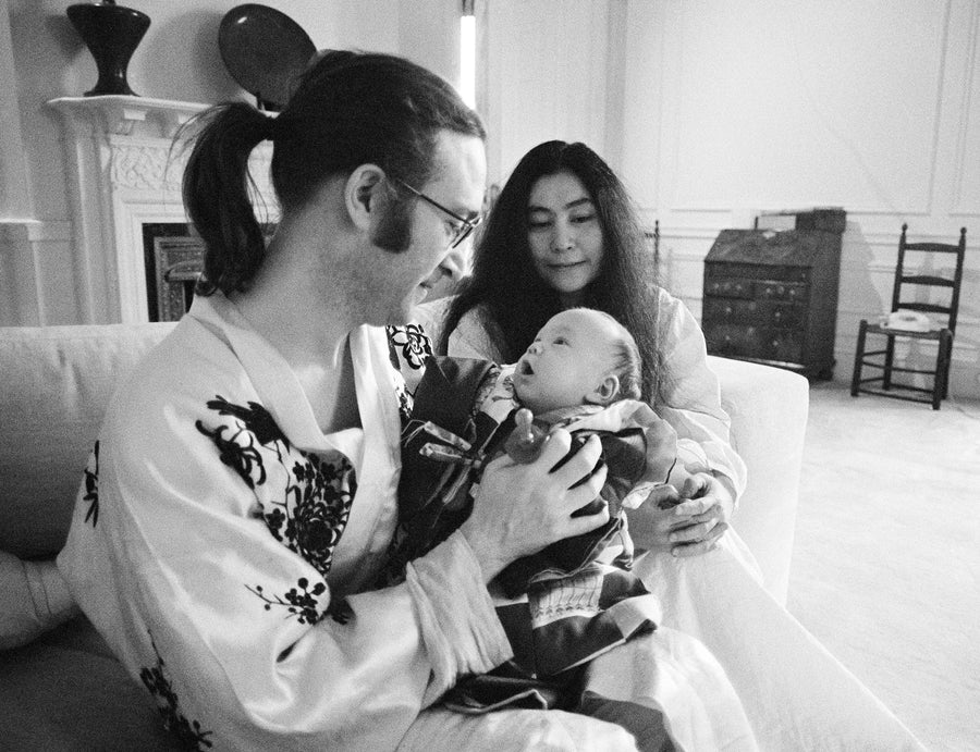 John Lennon holding Sean Lennon with Yoko Ono in New York City, 1975, photographed by Bob Gruen.