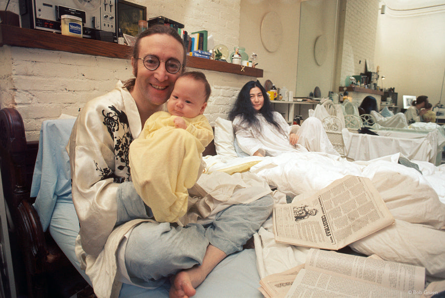 John Lennon holding Sean Lennon with Yoko Ono in New York City, 1975, photographed by Bob Gruen.