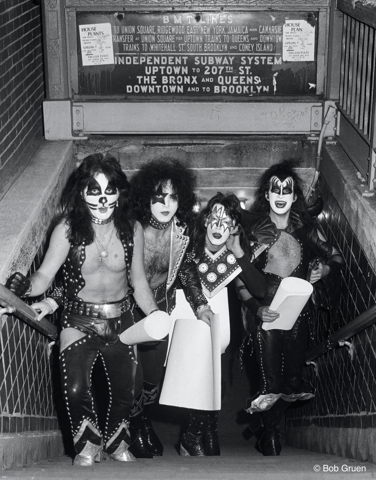 Members of Kiss emerging from a New York City subway station in full makeup, 1974, photographed by Bob Gruen.