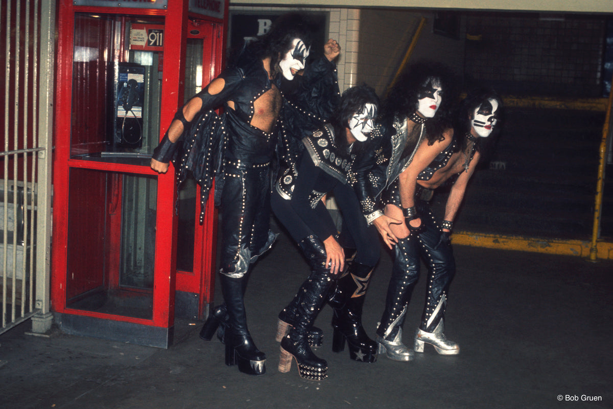 Members of Kiss exiting a phone booth in New York City, 1974, photographed by Bob Gruen.