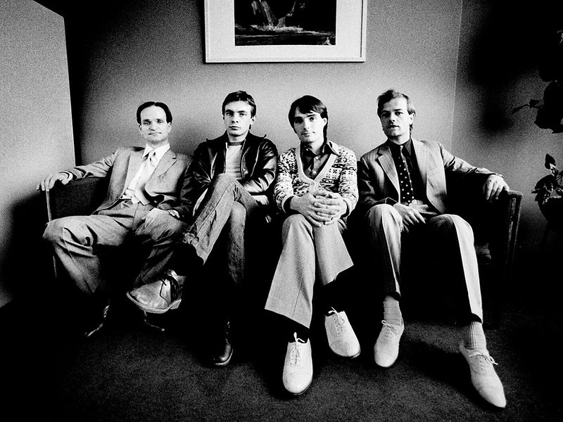 The four members of Kraftwerk seated together for a group portrait in 1976. Photograph by Gijsbert Hanekroot.