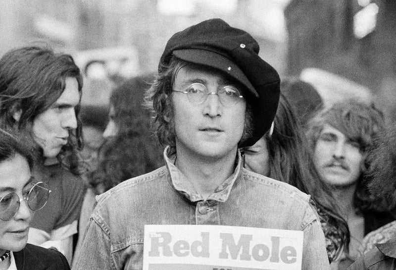 John Lennon and Yoko Ono at a political rally in London, UK, 1975, photographed by Rowland Scherman.