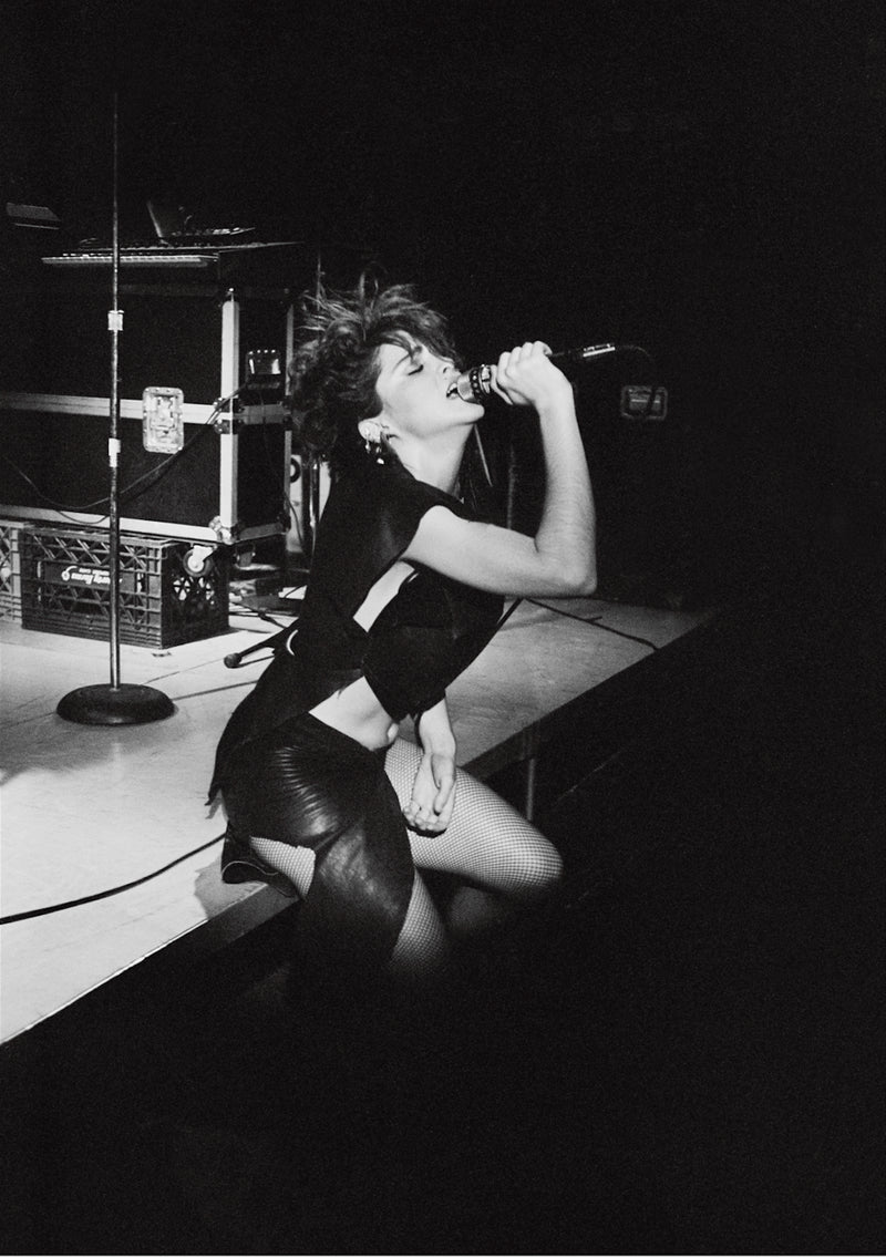 Madonna performing live onstage, photographed by George DuBose.
