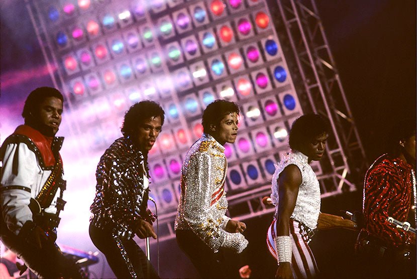Michael Jackson performing with his brothers on the Victory Tour, photographed by Charlyn Zlotnik, 1984.