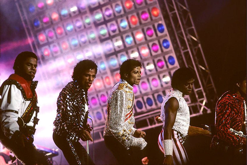 Michael Jackson performing with his brothers on the Victory Tour, photographed by Charlyn Zlotnik, 1984.
